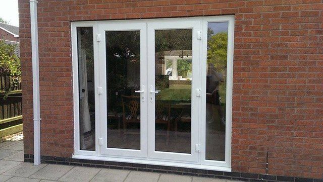 Composite front door with glass panels